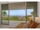 Cozy bedroom with views of the patio and city skyline beyond at 3 Horseshoe Rock Ct, Henderson, NV 89012