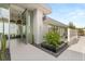 This home features a modern entryway with sleek planters and stylish lighting, creating an inviting and elegant entrance at 3 Horseshoe Rock Ct, Henderson, NV 89012