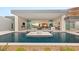 Stunning modern home exterior with an infinity pool, seamless indoor/outdoor living, and exceptional design at 3 Horseshoe Rock Ct, Henderson, NV 89012