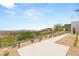 Landscaped walkway leading to a contemporary home with drought-tolerant landscaping and desert views at 3 Horseshoe Rock Ct, Henderson, NV 89012