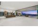 Expansive open floor plan with disappearing walls and a kitchen leading to an outdoor area with city views at 3 Horseshoe Rock Ct, Henderson, NV 89012
