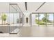 Modern hallway featuring glass walls, natural light, and sleek flooring at 3 Horseshoe Rock Ct, Henderson, NV 89012