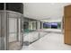 Hallway with glass elevator, hardwood floors, and floor-to-ceiling windows with city views at 3 Horseshoe Rock Ct, Henderson, NV 89012