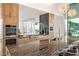 Modern kitchen with granite counters, stainless appliances, and great view at 3 Horseshoe Rock Ct, Henderson, NV 89012