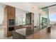 Modern kitchen with granite countertops, stainless steel appliances, and decorative pendant lighting at 3 Horseshoe Rock Ct, Henderson, NV 89012