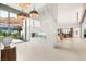 Stunning open-concept living area with marble fireplace and views to the outside at 3 Horseshoe Rock Ct, Henderson, NV 89012