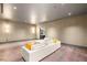 Spacious living room with modern sofa, wood floors, and neutral walls offering a comfortable and stylish space at 3 Horseshoe Rock Ct, Henderson, NV 89012