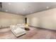 Open living room with a stylish white sofa and view of another room, offering versatile living space at 3 Horseshoe Rock Ct, Henderson, NV 89012