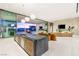 Spacious living room with a fireplace and granite kitchen island at 3 Horseshoe Rock Ct, Henderson, NV 89012