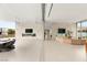 Expansive open-concept living space with modern furnishings, fireplace, and access to outdoor seating at 3 Horseshoe Rock Ct, Henderson, NV 89012