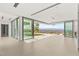 Spacious living room featuring floor-to-ceiling windows offering panoramic views, seamlessly blending indoor and outdoor living at 3 Horseshoe Rock Ct, Henderson, NV 89012