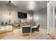 Modern lounge featuring a large screen TV, unique lighting, and stylish seating for relaxation at 3 Horseshoe Rock Ct, Henderson, NV 89012