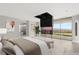 Luxury main bedroom featuring a pop-up television with views of the exterior at 3 Horseshoe Rock Ct, Henderson, NV 89012