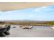 The patio boasts an in-ground pool, with an outdoor dining area, offering beautiful views of the surrounding landscape at 3 Horseshoe Rock Ct, Henderson, NV 89012