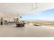 Expansive outdoor area featuring a dining table, outdoor kitchen, and infinity pool overlooking the city at 3 Horseshoe Rock Ct, Henderson, NV 89012