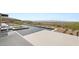 The backyard features a modern pool with water features and native desert landscaping, creating a serene outdoor retreat at 3 Horseshoe Rock Ct, Henderson, NV 89012