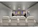 Home theater room featuring comfortable seating and a large projection screen at 3 Horseshoe Rock Ct, Henderson, NV 89012