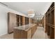 Custom walk-in closet with island, drawers and shelves at 3 Horseshoe Rock Ct, Henderson, NV 89012