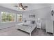 Serene bedroom with bright natural light, a ceiling fan, and neutral decor at 3005 Dotted Wren Ave, North Las Vegas, NV 89084