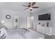 Spacious bedroom with a ceiling fan, TV, and bright natural light at 3005 Dotted Wren Ave, North Las Vegas, NV 89084