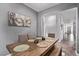 Cozy dining room featuring a wooden table with seating for six at 3005 Dotted Wren Ave, North Las Vegas, NV 89084