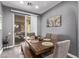 Cozy dining area with wood table, bench seating and sliding glass door leading to outdoor space at 3005 Dotted Wren Ave, North Las Vegas, NV 89084