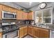 Updated kitchen with stainless steel appliances and a view of the backyard at 3005 Dotted Wren Ave, North Las Vegas, NV 89084