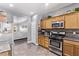 Bright kitchen features modern stainless steel appliances and convenient access to the living room at 3005 Dotted Wren Ave, North Las Vegas, NV 89084