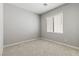 Comfortable bedroom featuring plush carpeting, a window with blinds, and ample natural light at 3237 Walker River St, North Las Vegas, NV 89032