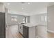 Bright and modern kitchen with a quartz island and stainless steel appliances, perfect for entertaining at 3237 Walker River St, North Las Vegas, NV 89032