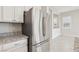 Modern kitchen featuring stainless steel refrigerator and granite countertops at 354 Spotted Dove St, Las Vegas, NV 89138