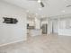 Bright kitchen and living area with stainless steel appliances and tile floors at 354 Spotted Dove St, Las Vegas, NV 89138