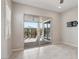 Bright living room with a sliding glass door leading to the patio and backyard at 354 Spotted Dove St, Las Vegas, NV 89138