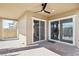 Covered patio featuring brick flooring, a ceiling fan, and sliding glass doors offering seamless indoor-outdoor living at 354 Spotted Dove St, Las Vegas, NV 89138