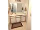 A well-lit bathroom with a vanity offering storage space and a large mirror at 3550 Bay Sands Dr # 3001, Laughlin, NV 89029