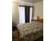 A nicely decorated bedroom featuring a floral quilt on the bed and lots of natural light at 3550 Bay Sands Dr # 3001, Laughlin, NV 89029