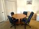 Dining room with a round table and four chairs next to a closet at 3550 Bay Sands Dr # 3001, Laughlin, NV 89029