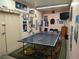 Spacious game room with ping pong table, TV, and eclectic decor for entertaining and relaxation at 3550 Bay Sands Dr # 3001, Laughlin, NV 89029