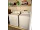 A functional laundry room equipped with a washer, dryer, and convenient upper shelf for storage at 3550 Bay Sands Dr # 3001, Laughlin, NV 89029