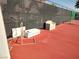 Seating area and equipment storage on community tennis courts surrounded by fencing at 3550 Bay Sands Dr # 3001, Laughlin, NV 89029