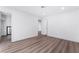 Empty bedroom featuring new laminate flooring, closet, and neutral-toned walls at 3937 S Torrey Pines Dr, Las Vegas, NV 89103