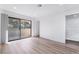 Empty bedroom featuring new laminate flooring, closet, and neutral-toned walls at 3937 S Torrey Pines Dr, Las Vegas, NV 89103