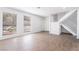 An inviting living area with light flooring, large windows, staircase, and neutral decor, creating a cozy atmosphere at 3937 S Torrey Pines Dr, Las Vegas, NV 89103