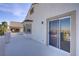 Spacious stucco balcony with tan trim provides an area for outdoor relaxation and viewing neighborhood scenery at 4012 Owlshead Mountain St, Las Vegas, NV 89129