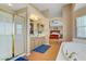 Bright primary bathroom with tub, shower, double vanity, and view into the primary bedroom at 4012 Owlshead Mountain St, Las Vegas, NV 89129