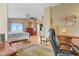 Bright bedroom features wood floors, ceiling fan, and an adjacent office space with built-in desk at 4012 Owlshead Mountain St, Las Vegas, NV 89129