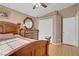 Cozy bedroom featuring a well-crafted wooden bed frame, dresser and neutral-toned walls and carpeting at 4012 Owlshead Mountain St, Las Vegas, NV 89129
