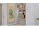 Inviting hallway with neutral tones, tiled floors, and views into multiple rooms of the home at 4012 Owlshead Mountain St, Las Vegas, NV 89129