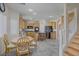 Spacious kitchen with an island, stainless steel refrigerator, and stairs at 4012 Owlshead Mountain St, Las Vegas, NV 89129