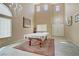 Bright, spacious living room featuring high ceilings and natural light, showcasing an inviting and comfortable space at 4012 Owlshead Mountain St, Las Vegas, NV 89129